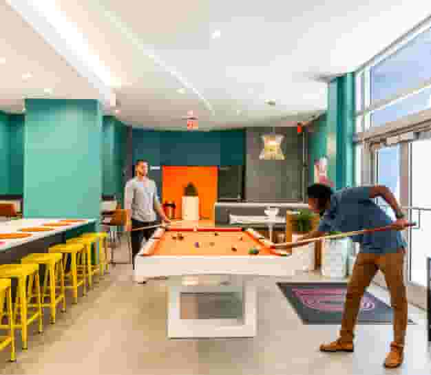 Students playing pool at Identity Miami